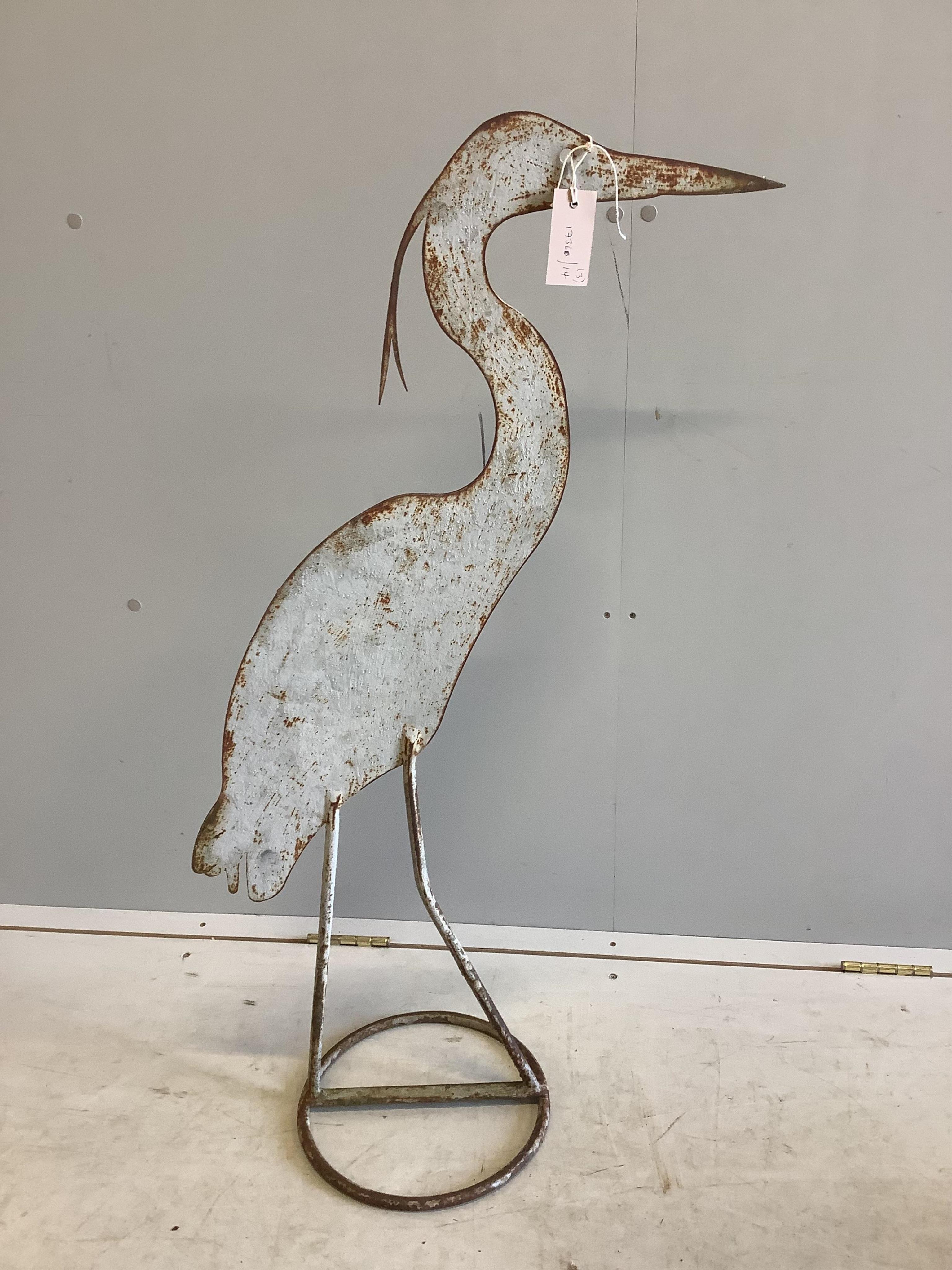 A painted wrought iron heron garden ornament, height 98cm, a metal bird ornament and a stag's head bowl. Condition - fair